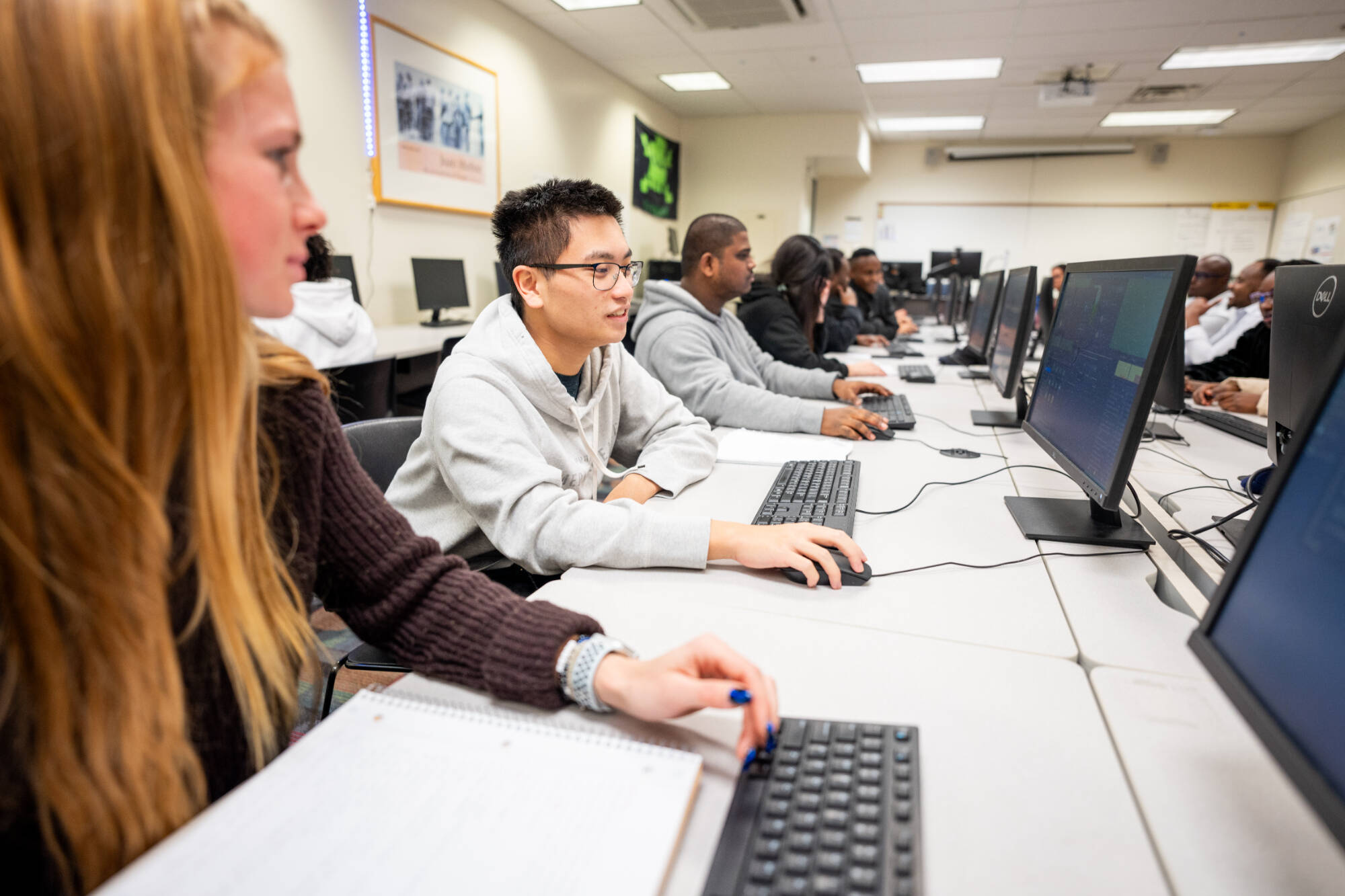 Students from Professor Samah Mansour's computing class work in the Cyber Threat Range, December 4, 2023.